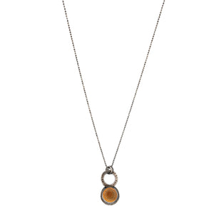 Original Sin Jewelry Focus style necklace with circle and radiant texture set with an Oregon fire opal all oxidized silver