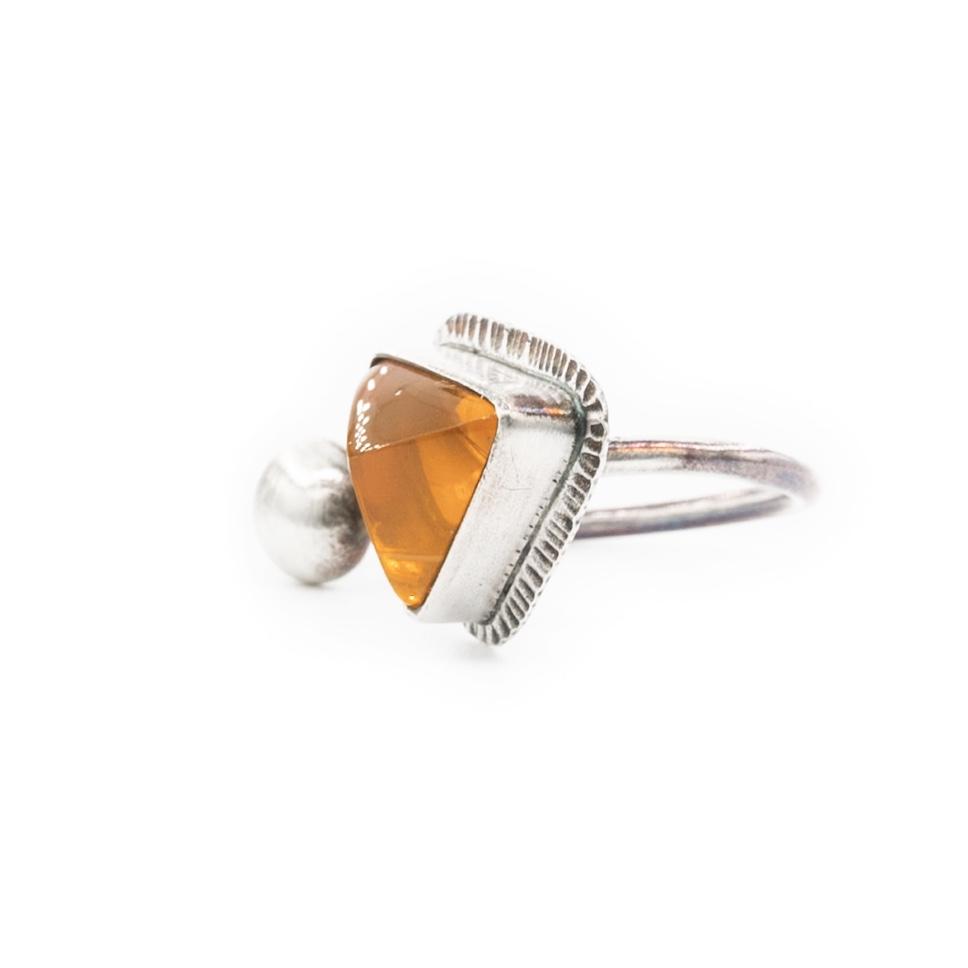 faceted Oregon orange fire opal set in oxidized silver open contemporary minimalist ring by Original Sin Jewelry